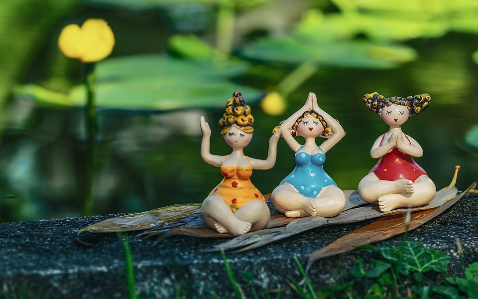 Image of 3 Figurines in Yoga Pose